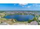 Scenic aerial view of community pond, green spaces and lush landscaping at 13838 Walcott Ave, Orlando, FL 32827