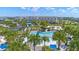 A lavish community pool with a water slide, palm trees, and lounge chairs for relaxation and enjoyment at 13838 Walcott Ave, Orlando, FL 32827