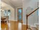 Foyer view of dining area with wooden floors and natural lighting at 13838 Walcott Ave, Orlando, FL 32827