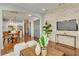 Open-concept living area showcasing stone accent wall, modern furniture, and seamless flow into the kitchen at 13838 Walcott Ave, Orlando, FL 32827