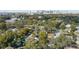 Aerial view of property in a verdant location near city skyline at 1410 Osceola Ct, Orlando, FL 32806