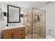 Bathroom featuring tiled shower, updated vanity, and modern fixtures at 1410 Osceola Ct, Orlando, FL 32806