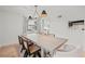 Modern dining room featuring an elegant table, designer lighting, and seamlessly connects to other living areas at 1410 Osceola Ct, Orlando, FL 32806