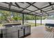 View of the covered outdoor kitchen featuring stainless steel grill on a wood patio at 1410 Osceola Ct, Orlando, FL 32806