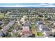 Aerial view of a neighborhood featuring cozy homes with lush green trees and community pool at 15323 Torpoint Rd, Winter Garden, FL 34787