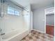 This is a bathroom with a shower and wood-style flooring at 15323 Torpoint Rd, Winter Garden, FL 34787