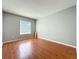 Bright bedroom with hardwood floors and a large window at 15323 Torpoint Rd, Winter Garden, FL 34787