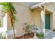 Close-up of decorative water feature and front entrance with desert landscaping at 15323 Torpoint Rd, Winter Garden, FL 34787