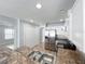 Kitchen featuring stainless steel appliances, granite counters, white cabinets, and tile flooring at 15323 Torpoint Rd, Winter Garden, FL 34787