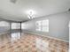 Bright living room with tile flooring, neutral walls, and natural light from large windows at 15323 Torpoint Rd, Winter Garden, FL 34787