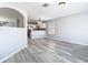 Living area leads to kitchen featuring a breakfast bar, perfect for entertaining at 15323 Torpoint Rd, Winter Garden, FL 34787