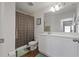 Bright bathroom with a shower/tub combination, white vanity with ample counter space and updated fixtures at 1629 Hill Park Dr, Deltona, FL 32725