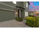 Close-up of the home's exterior with a well-manicured front garden and inviting entrance at 1629 Hill Park Dr, Deltona, FL 32725