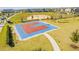 Aerial view of the community basketball court with landscaping and nearby residential homes at 17846 Adrift Rd, Winter Garden, FL 34787