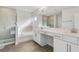 Bright bathroom features a double vanity, soaking tub and glass enclosed shower at 17846 Adrift Rd, Winter Garden, FL 34787