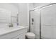 Modern bathroom with glass-enclosed shower, white subway tiles, and a vanity at 17846 Adrift Rd, Winter Garden, FL 34787