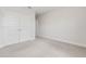 Bedroom with neutral carpet and walk-in closet, offering ample storage at 17846 Adrift Rd, Winter Garden, FL 34787