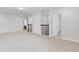 Upstairs hallway featuring neutral carpet and a wrought iron railing at 17846 Adrift Rd, Winter Garden, FL 34787