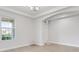 Bright living room with light wood flooring, an archway, and a large window at 17846 Adrift Rd, Winter Garden, FL 34787