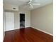 Bedroom with hardwood floors and ensuite bathroom at 202 E South St # 5037, Orlando, FL 32801