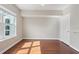 Bedroom featuring hardwood floors, a large window, and a closet at 202 E South St # 5037, Orlando, FL 32801