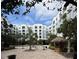 Exterior courtyard view with trees, seating and a tiki bar at 202 E South St # 5037, Orlando, FL 32801