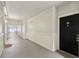 Well-lit hallway with neutral colors and classic paneling leading to unit door at 202 E South St # 5037, Orlando, FL 32801