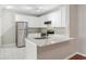 Modern kitchen with stainless steel appliances, granite countertops, and white cabinets at 202 E South St # 5037, Orlando, FL 32801