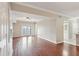 Living room featuring hardwood floors, neutral paint, and a sliding glass door to balcony at 202 E South St # 5037, Orlando, FL 32801