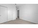 Bedroom featuring light colored wood floors, white walls, and a sliding door closet at 205 Famagusta Dr, Davenport, FL 33896