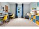 Bright bedroom with a modern minimalist design, featuring a desk area, chair and decorative storage cubes at 2105 Red Rock Rd, New Smyrna Beach, FL 32168