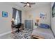 Neutral bedroom with a desk, ceiling fan and comfortable bed at 2157 Bay Line Rd, Oakland, FL 34787