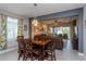 Dining area with seating for six, opens into a spacious living room with a view to the screened lanai at 2157 Bay Line Rd, Oakland, FL 34787