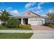 Charming single-story home with brick driveway, manicured lawn, and attached two-car garage at 2157 Bay Line Rd, Oakland, FL 34787