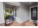 Cozy front porch featuring rocking chairs and decorative welcome mat; perfect for relaxing at 2157 Bay Line Rd, Oakland, FL 34787