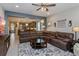 Open concept living room that leads to the kitchen and features a large sectional sofa at 2157 Bay Line Rd, Oakland, FL 34787