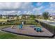 Community playground with a variety of play equipment and lush landscaping at 2157 Bay Line Rd, Oakland, FL 34787