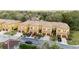 Aerial view of townhomes with attached garages, showing the well-maintained landscaping and community layout at 2344 Aloha Bay Ct, Ocoee, FL 34761