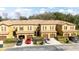 Aerial view of the townhome complex showcasing well-maintained landscaping and multiple parking spaces at 2344 Aloha Bay Ct, Ocoee, FL 34761