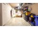 Well-organized garage with overhead and wall-mounted storage racks for ample storage at 2344 Aloha Bay Ct, Ocoee, FL 34761