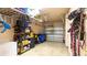 Spacious garage with ample storage shelves and overhead racks to keep organized at 2344 Aloha Bay Ct, Ocoee, FL 34761