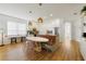 Modern eat-in kitchen featuring white cabinets, stainless steel appliances, and stylish pendant lighting at 2502 Cypress Trace Cir, Orlando, FL 32825