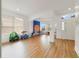 Bright and airy living room featuring wood floors, large windows, and an open concept design at 2502 Cypress Trace Cir, Orlando, FL 32825