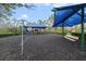 Community playground with swings and play structures under sunshades offers fun outdoor recreation at 2502 Cypress Trace Cir, Orlando, FL 32825