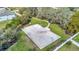 Aerial view of a full-sized community basketball court, surrounded by trees at 3086 Fieldwood Cir, St Cloud, FL 34772