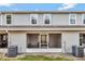 Rear exterior of the property featuring a screened-in patio area with air conditioning units at 3086 Fieldwood Cir, St Cloud, FL 34772