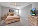 Cozy bedroom with a ceiling fan, wooden bed frame, and matching wooden dresser at 3086 Fieldwood Cir, St Cloud, FL 34772