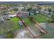 Aerial view with property lines of waterfront home with private dock and tranquil lake views in quiet neighborhood at 331 Bay St, Auburndale, FL 33823