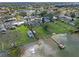 Aerial view of waterfront home featuring a private dock and peaceful lake views in a quiet neighborhood at 331 Bay St, Auburndale, FL 33823