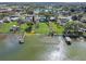 Scenic aerial view of waterfront homes with private docks and lake views in established neighborhood at 331 Bay St, Auburndale, FL 33823